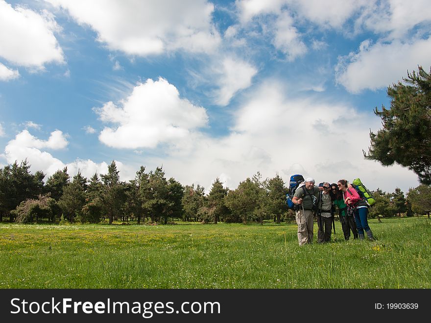A group of hikers enjoying a sunny day. A group of hikers enjoying a sunny day