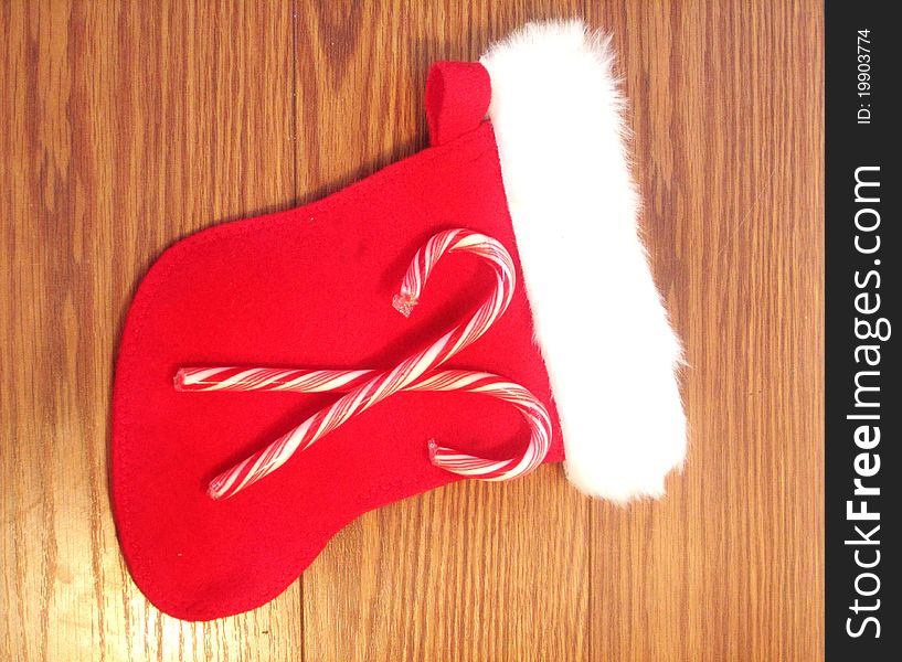 Christmas stocking with two candy canes on top