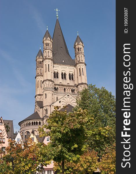 View over Great Saint Martin Church from Fischmarkt in Cologne. This Romanesque church was erected between 1150-1250 and its soaring crossing tower is a landmark of Cologne's Old Town