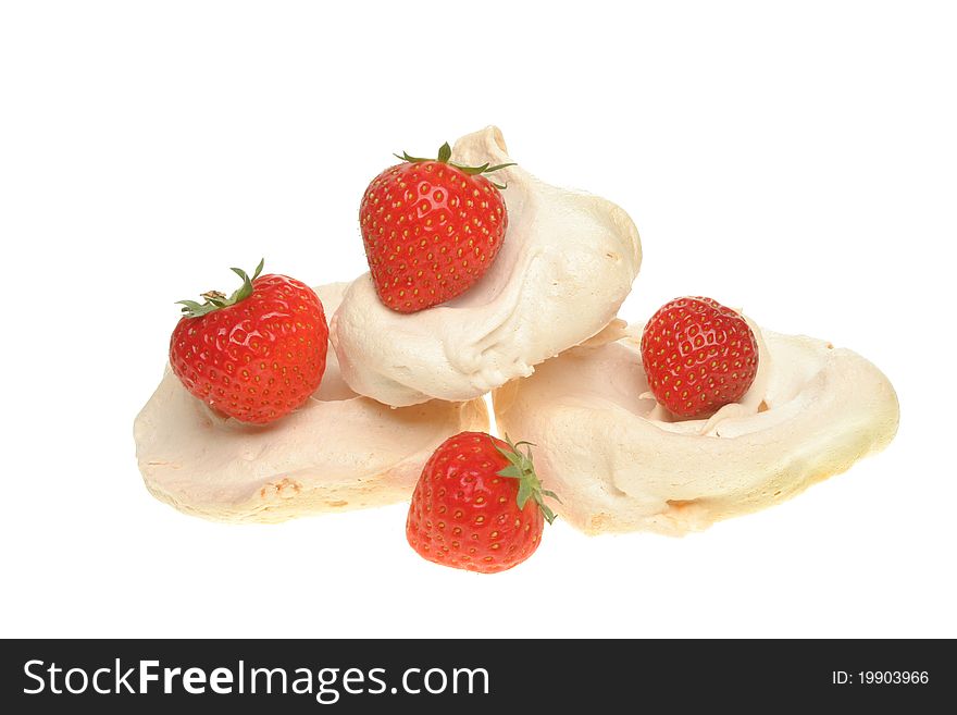 Strawberries and homemade meringues isolated against white. Strawberries and homemade meringues isolated against white