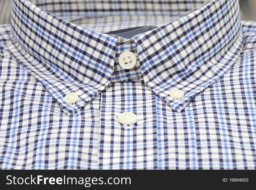 Nicely folded men shirt with focus on the collar