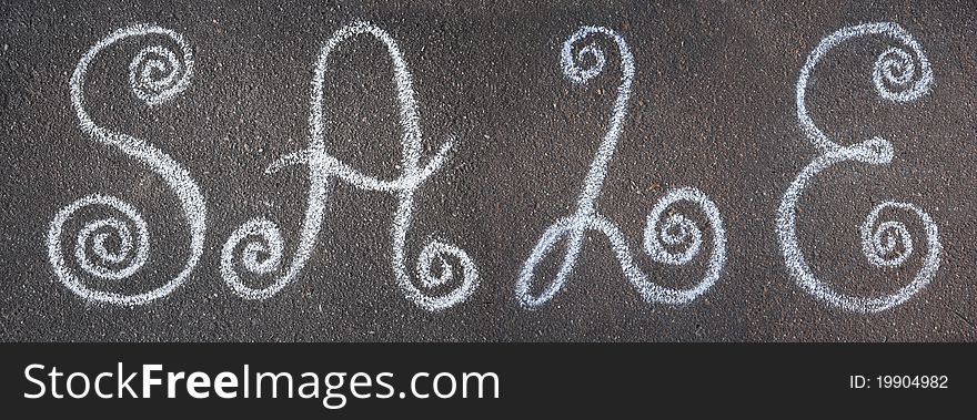 The inscription sale drawn on asphalt with chalk