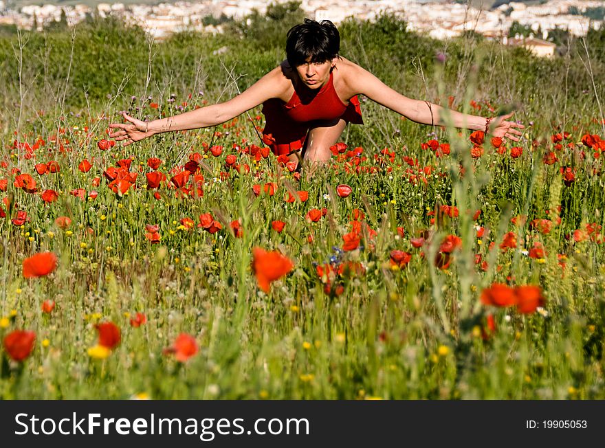 A girl dressed in red like a big poppy, like a mother for them. A girl dressed in red like a big poppy, like a mother for them.