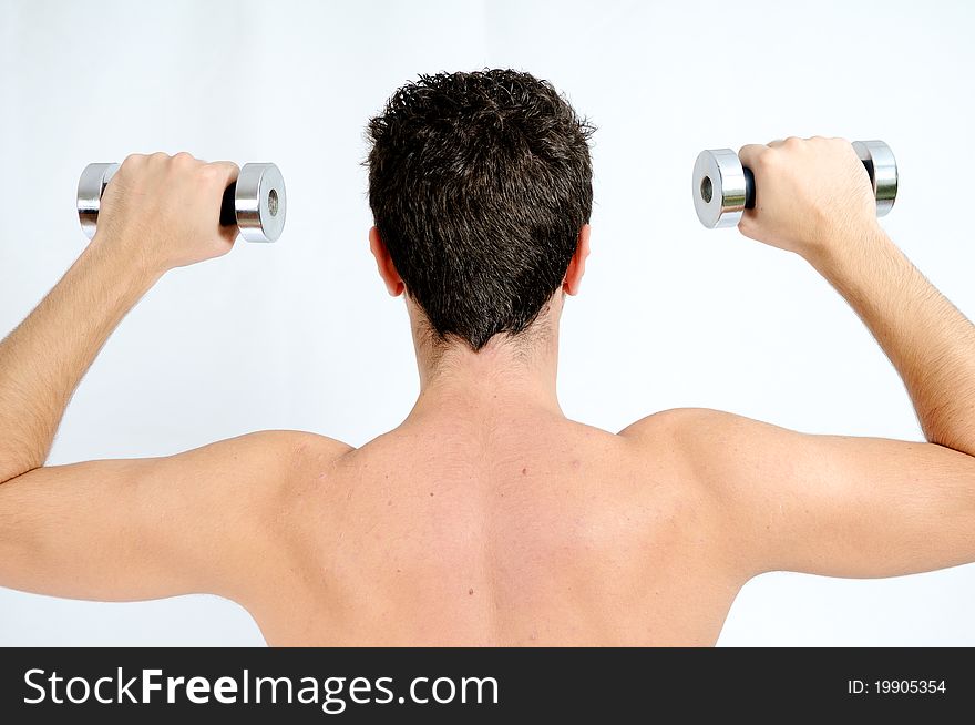 A Young man lifting weights on white background. A Young man lifting weights on white background