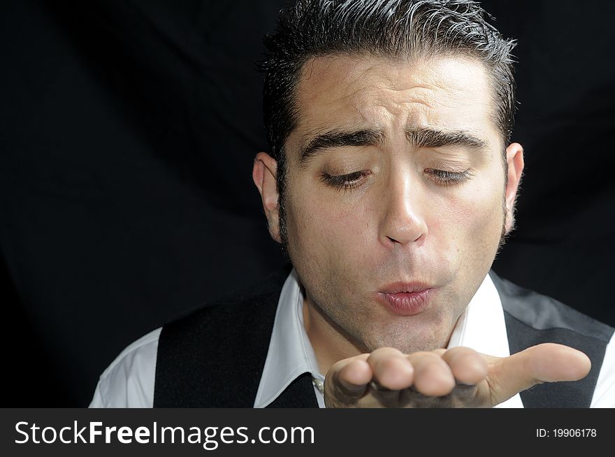 A man blowing a kiss