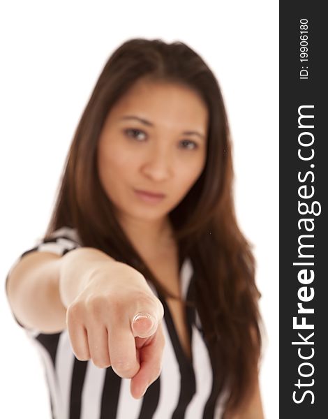 A woman in her referee out fit pointing her finger at the camera. A woman in her referee out fit pointing her finger at the camera.