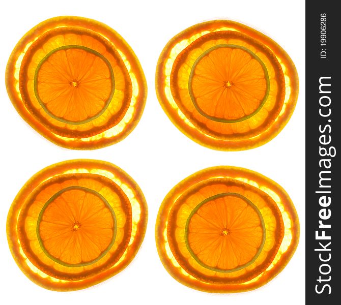 Sections of thinly sliced Grapefruit, Orange & Lime isolated on a White background.