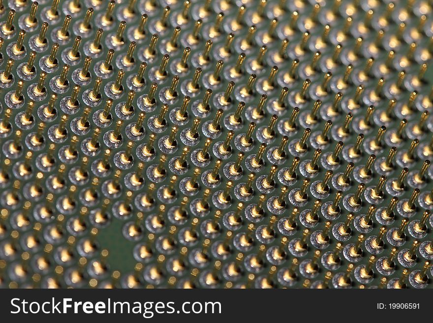 An macro shot of some golden cpu connector pins. An macro shot of some golden cpu connector pins