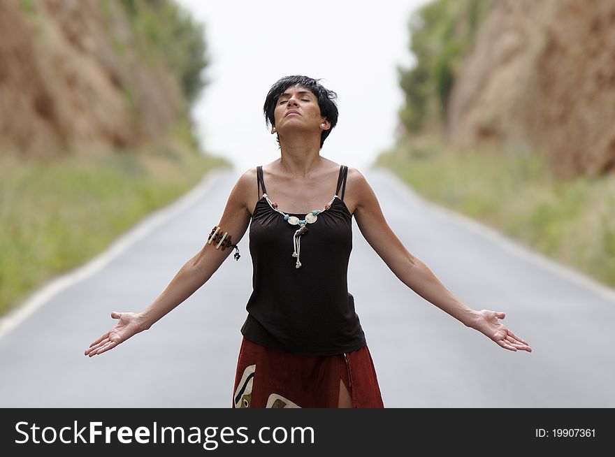 A woman with the eyes closed on the road. A woman with the eyes closed on the road