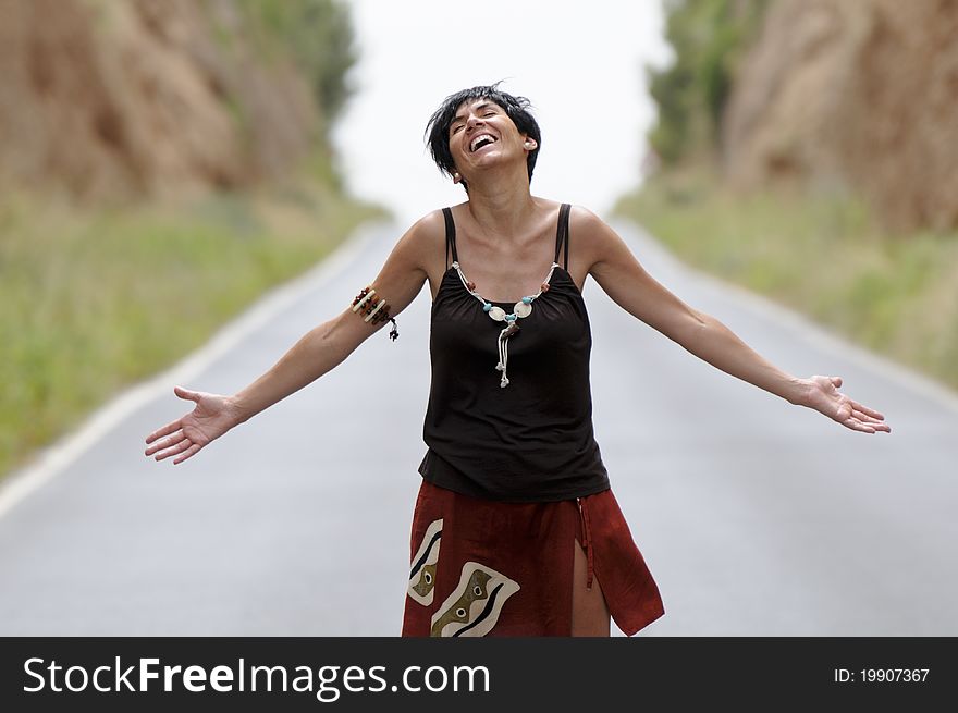Woman Laughing On The Road