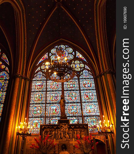 Candle And Stained Window In Notre Dame , Paris