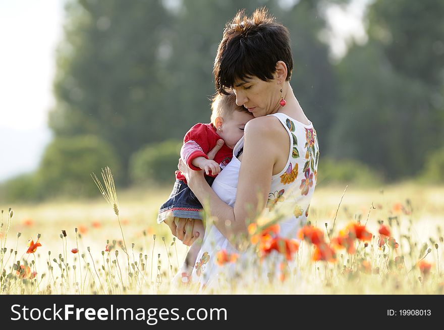 Mother And Daughter In A Poppy Field