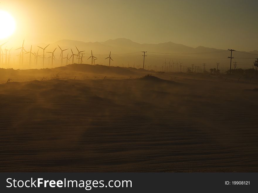 Windmills and Blowing Sand at Sunset near Palm Springs, CA. Windmills and Blowing Sand at Sunset near Palm Springs, CA