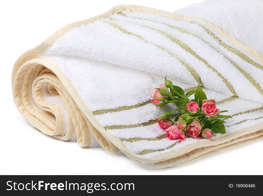 Terry towel with a small bouquet of roses isolated on white background