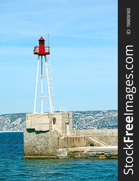 Light beacon at the entrance of a harbor