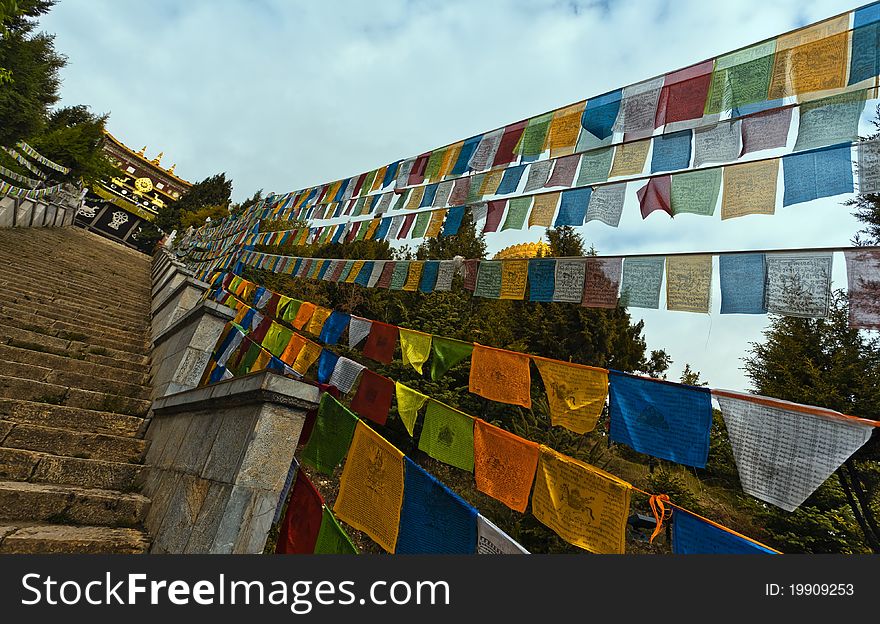 Prayer flags and songzanlin temple,shangri-la china. Prayer flags and songzanlin temple,shangri-la china.