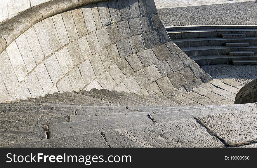 Granite curve modern stairs with stone handrail on a wharf. Granite curve modern stairs with stone handrail on a wharf