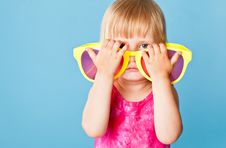 A Little Girl With A Huge Sunglasses Stock Photography A Little Girl With A Huge Sunglasses Stock Photography