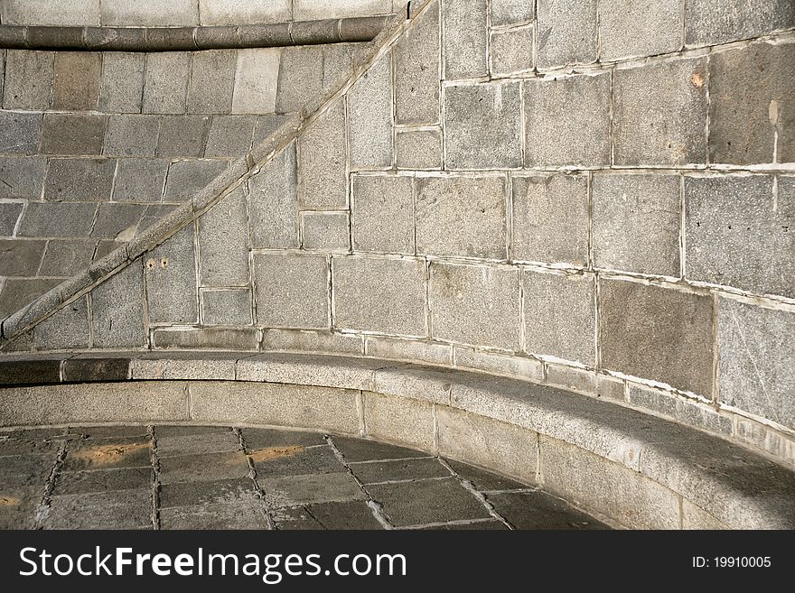 Curve Section Of A Granite Stone Wall And Floor