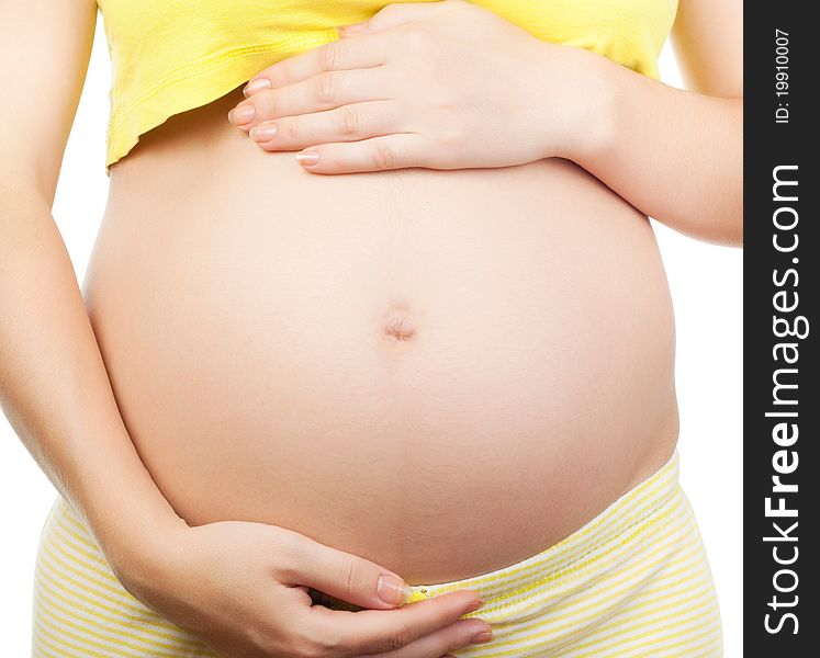 Image of pregnant woman touching her belly with hands