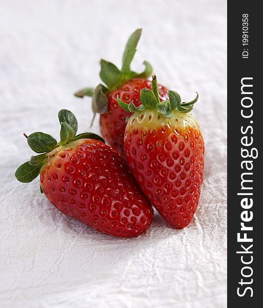 Fresh strawberries on a fabric background. Fresh strawberries on a fabric background.