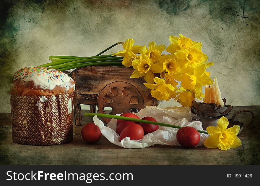 Easter still life consists of bouquet of narcissuses, baking and eggs. Easter still life consists of bouquet of narcissuses, baking and eggs