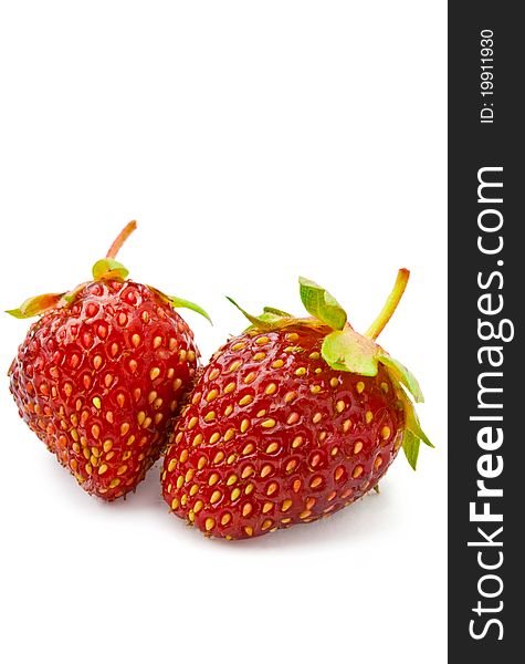 Two strawberries on a white background isolated. Two strawberries on a white background isolated