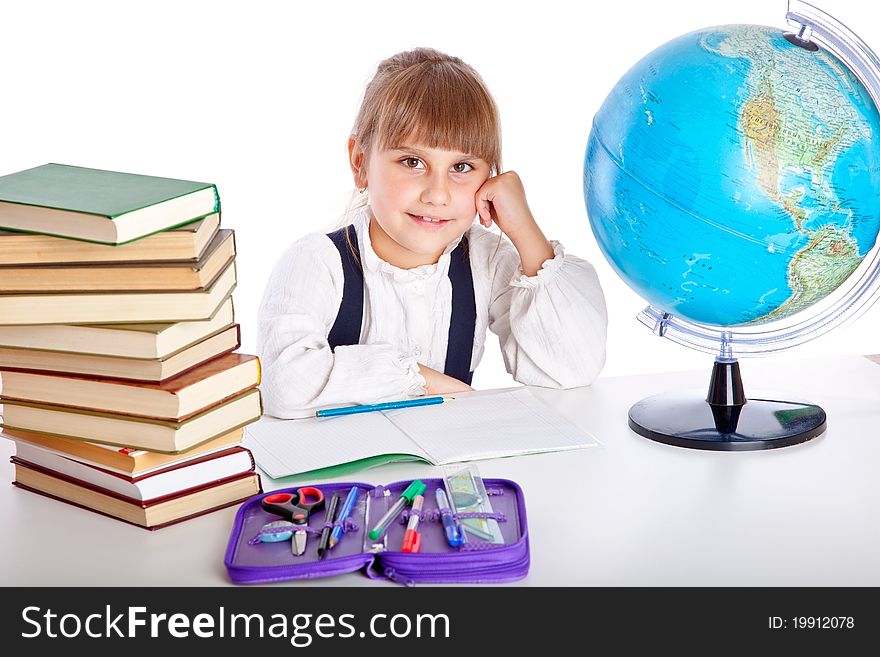 Girl is doing homework. Isolated on white background