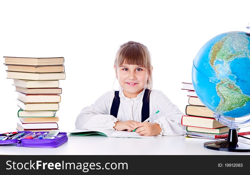 Girl is doing homework. Isolated on white background