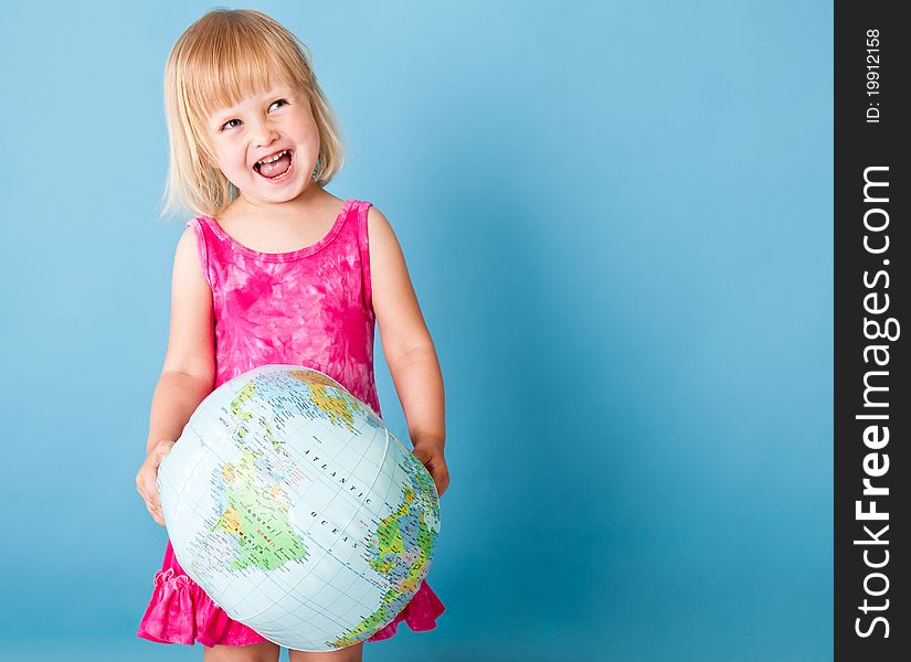A little girl with a globe