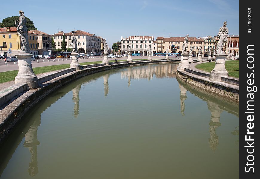 The statues at the Prato della Valle reflected in water, Padua, Italy. The statues at the Prato della Valle reflected in water, Padua, Italy