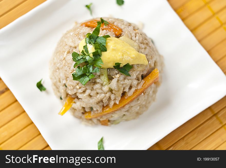 Rice with vegetables with top of mustard