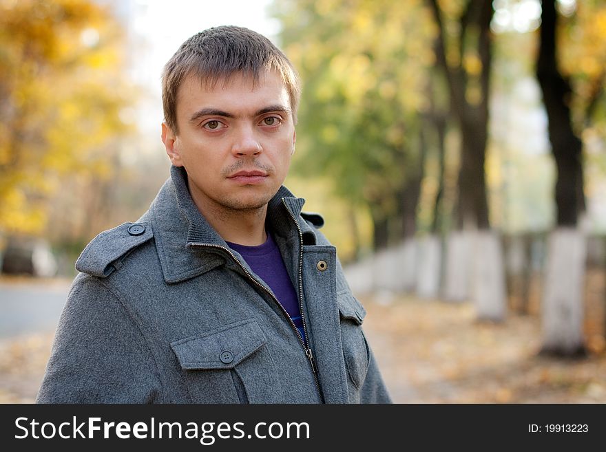 Portrait of a young man with a keen eye on the street