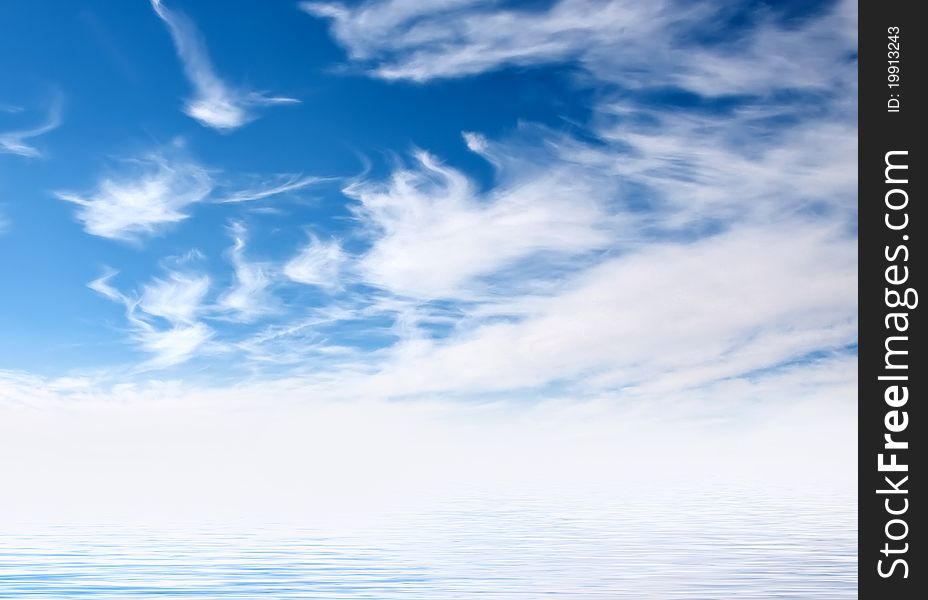 Blue sky covered with white clouds in the reflection