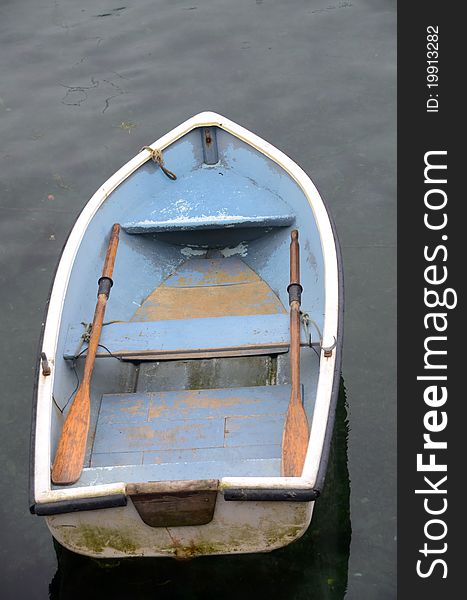 Looking down on a dinghy from a bridge above