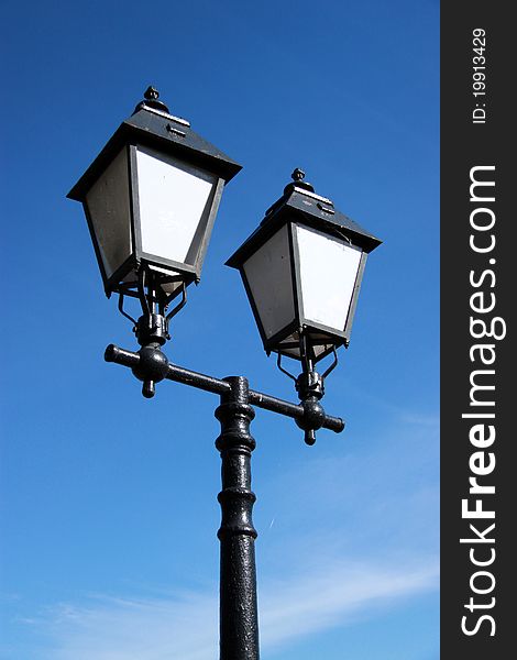 Vintage lamp on blue background