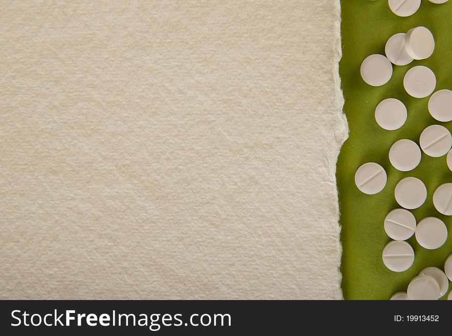 Pills background with green and white paper
