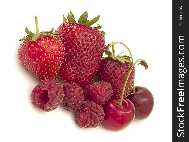 Strawberries , raspberries and cherries on the white. Strawberries , raspberries and cherries on the white