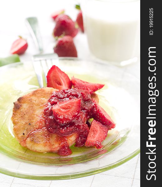 Pancakes with strawberries jam and fresh strawberry