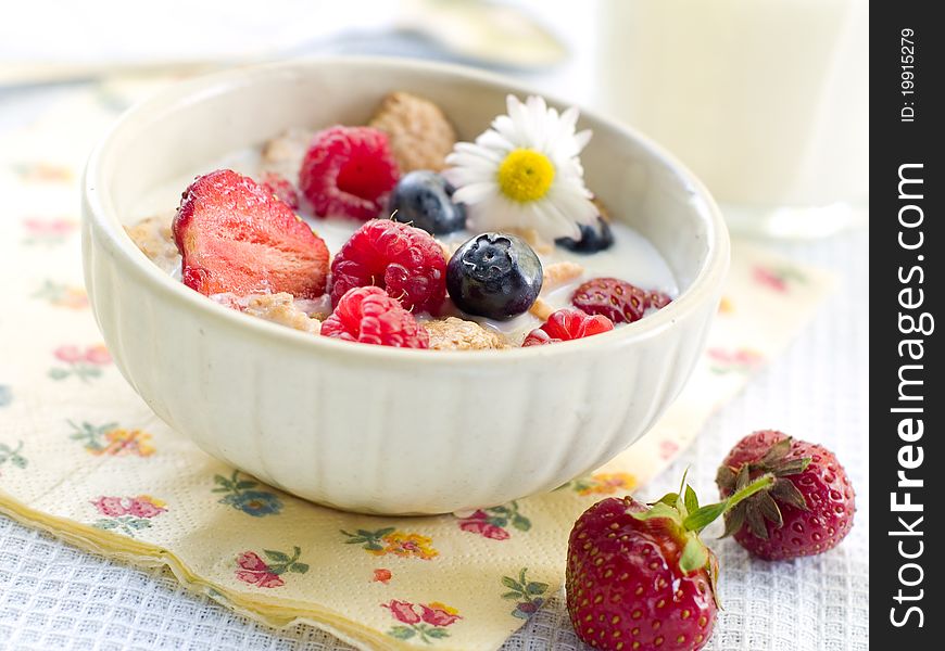 Oat flakes with berries and milk for breakfast. Selective focus