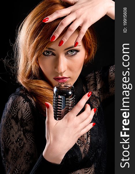 Gorgeous stylish redhead woman with retro microphone. Gorgeous stylish redhead woman with retro microphone