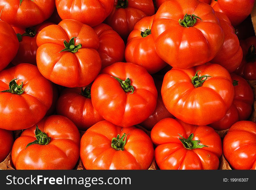 Tomatoes With Stalks In A Market