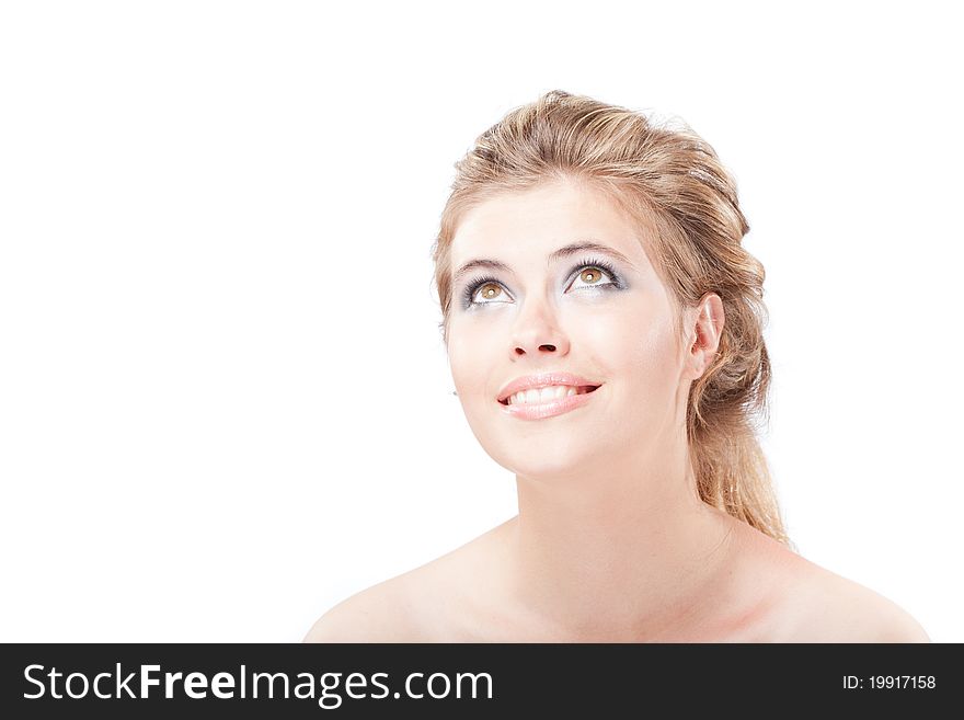 Beautiful dreamy happy young woman looking up