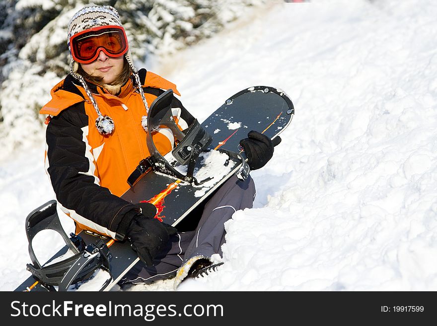 Young woman snowboarder