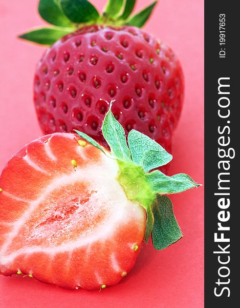 Ripen strawberry over red background