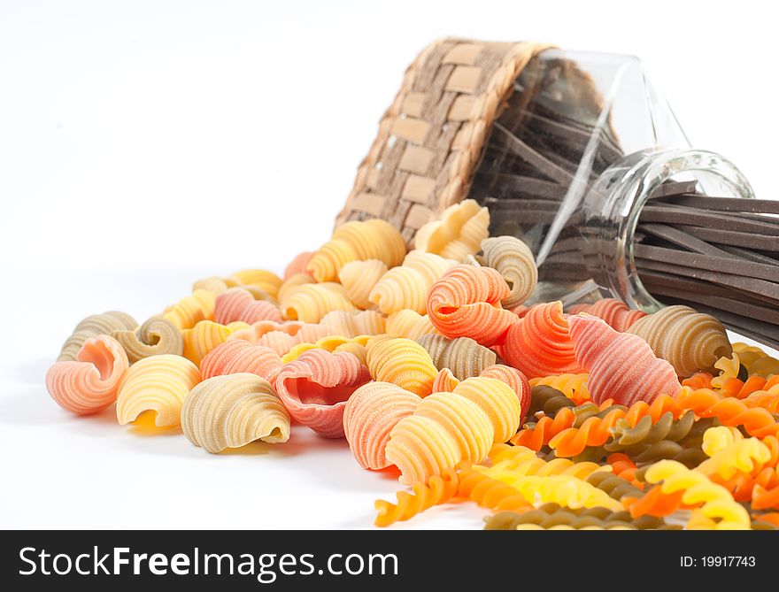 Different kinds of italian pasta on white background