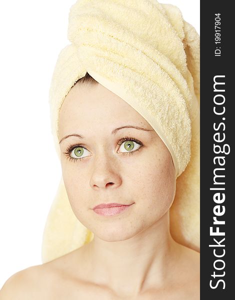 Young beautiful woman in the towel on the head