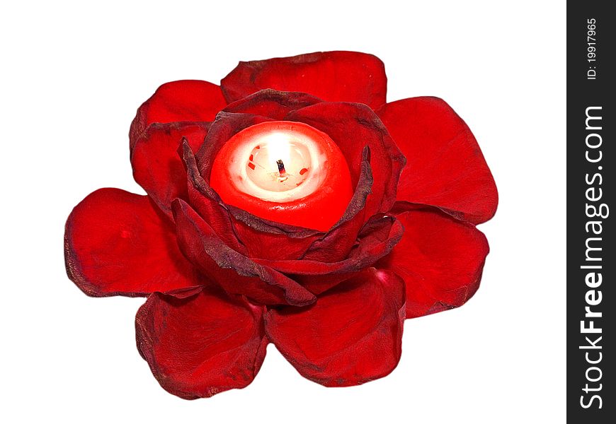 Red roses leavs and glowing candle isolated on white background. Red roses leavs and glowing candle isolated on white background.