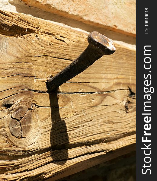 Antique Nail In A Wooden Board