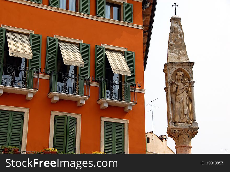 Building exterior details and saint statue in Verona, Italy. Building exterior details and saint statue in Verona, Italy